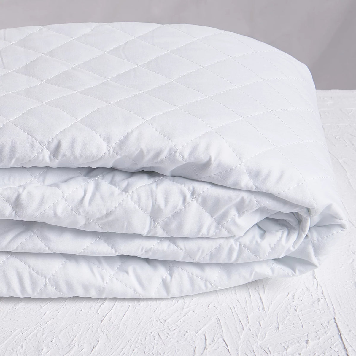 Royal Rest Quilted Mattress Protector, folded, white diamond quilting
