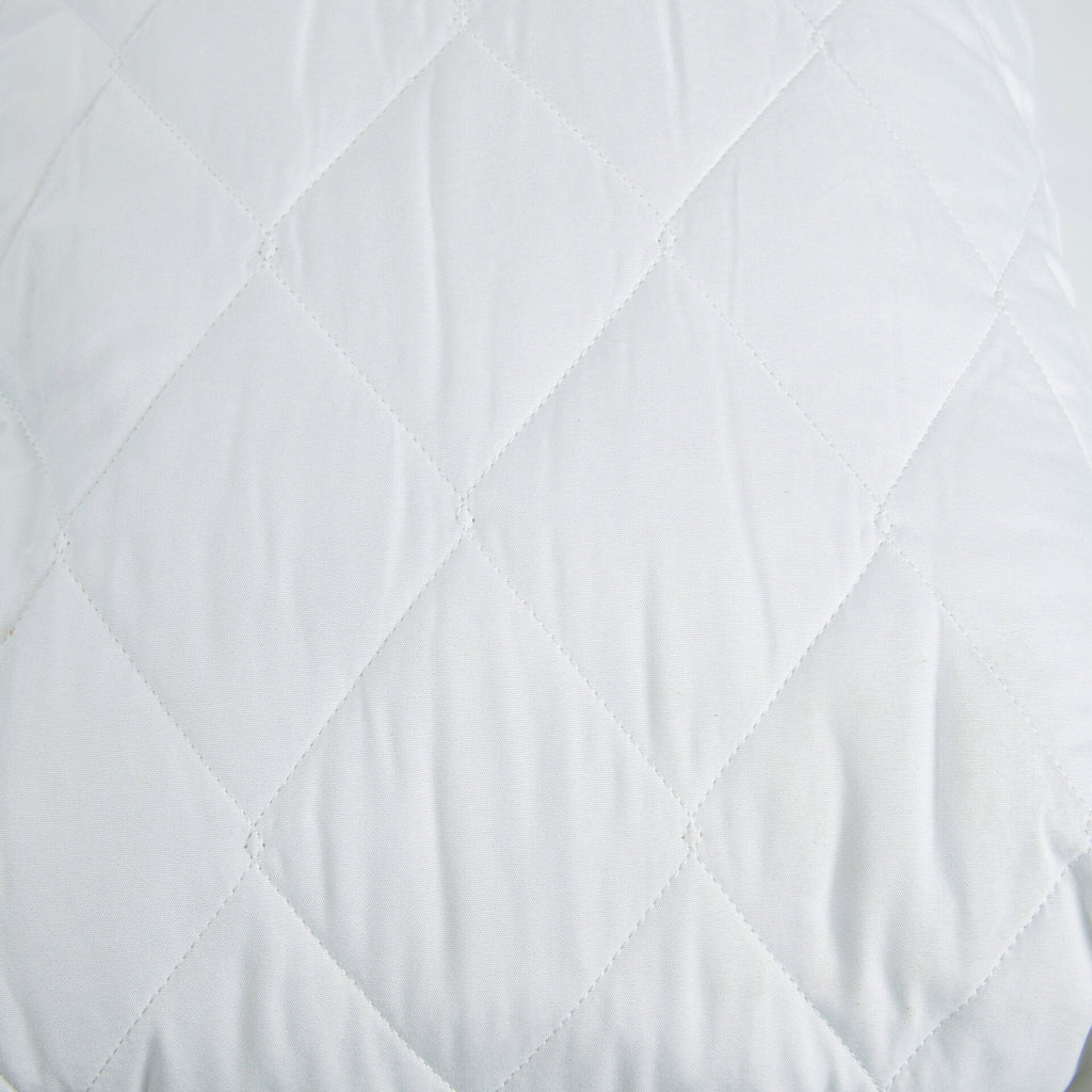 Close-up of the Royal Rest Quilted Mattress Protector's soft diamond quilting