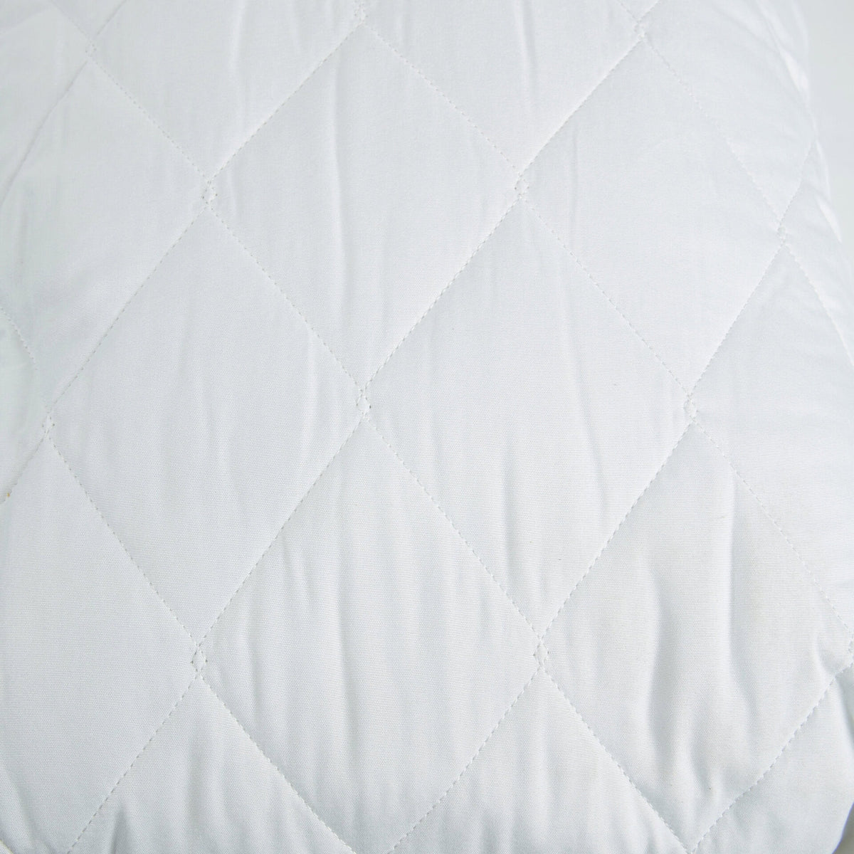 Close-up of the Royal Rest Quilted Mattress Protector's soft diamond quilting